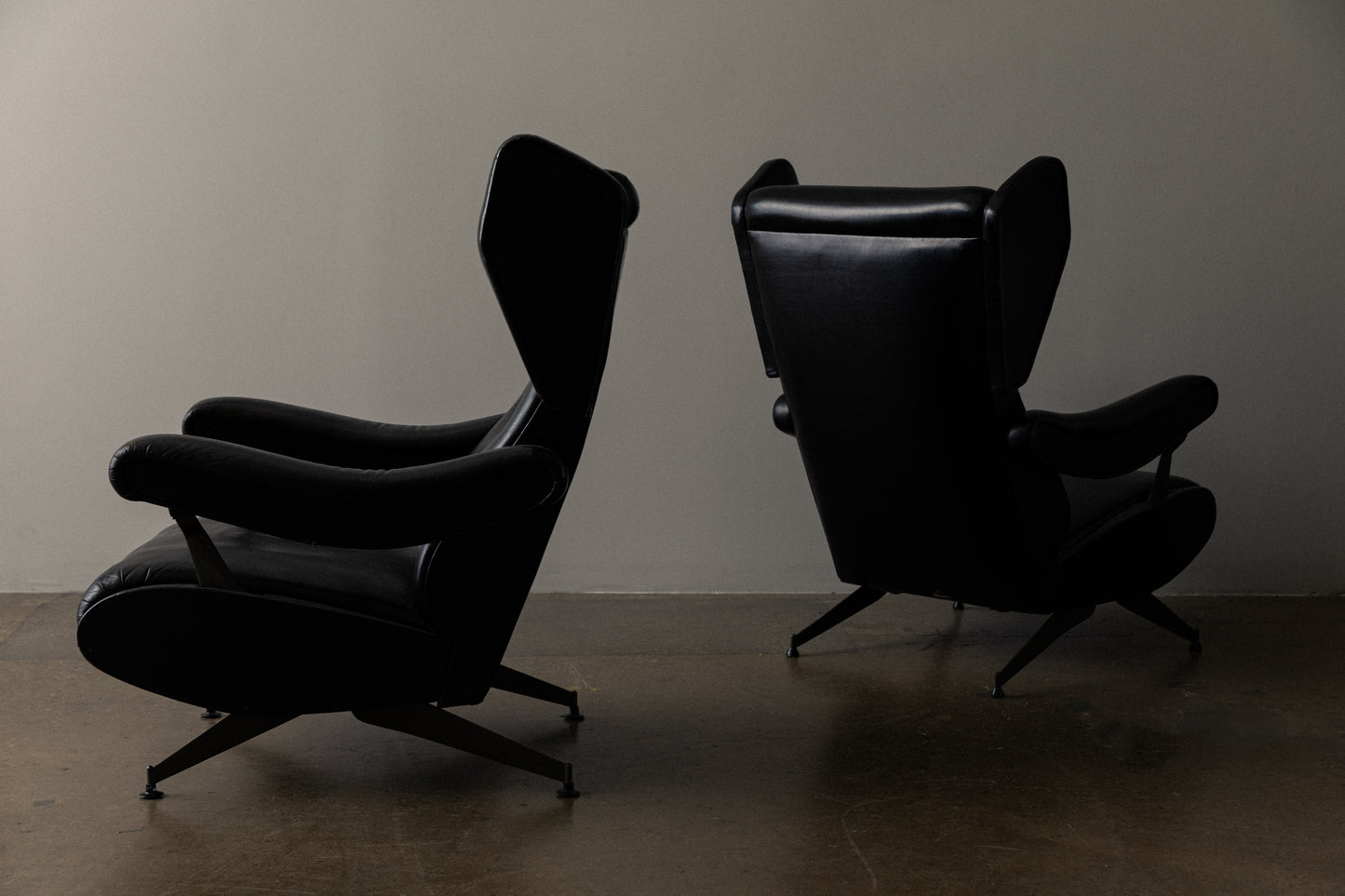 Pair of Italian Reclining Black Leather Armchairs