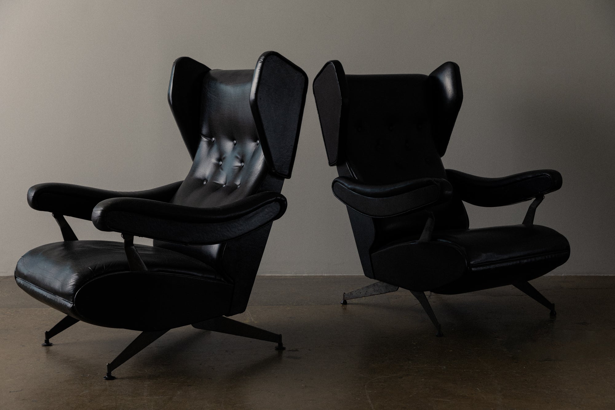 Pair of Italian Reclining Black Leather Armchairs