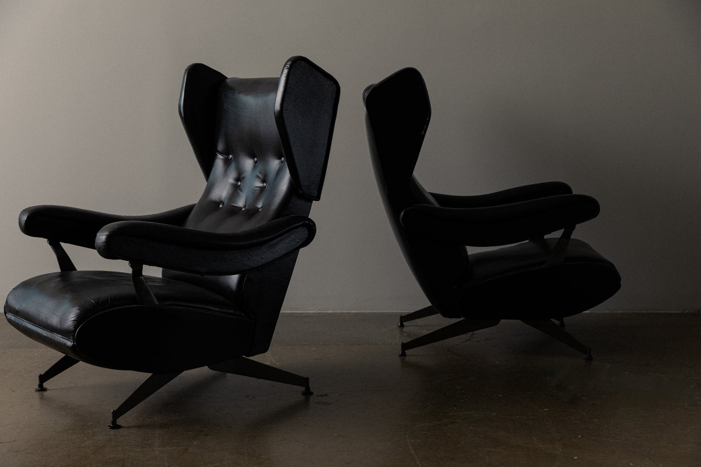 Pair of Italian Reclining Black Leather Armchairs